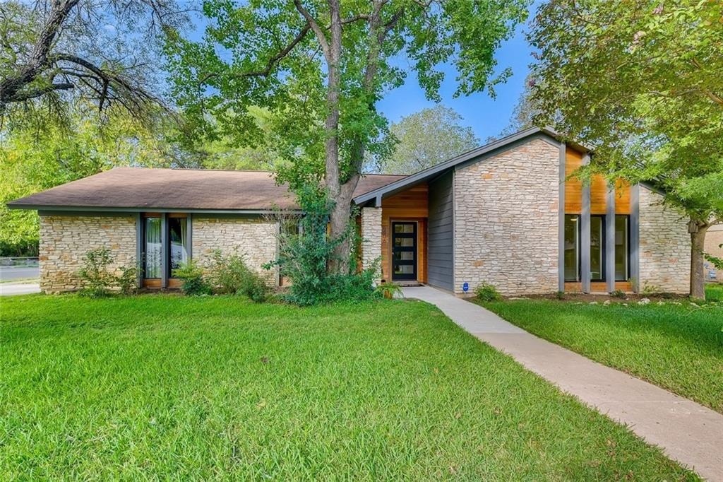 6406 Blarwood Dr exterior after renovation by GCO Development — modern stone and cedar