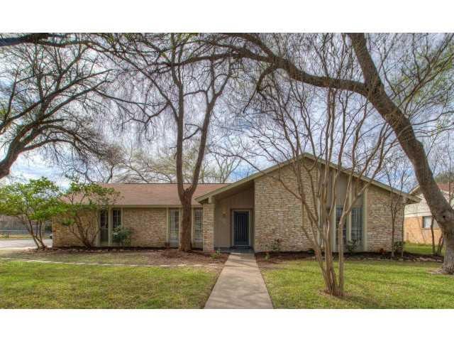 6406 Blarwood Dr exterior before renovation — original brick ranch